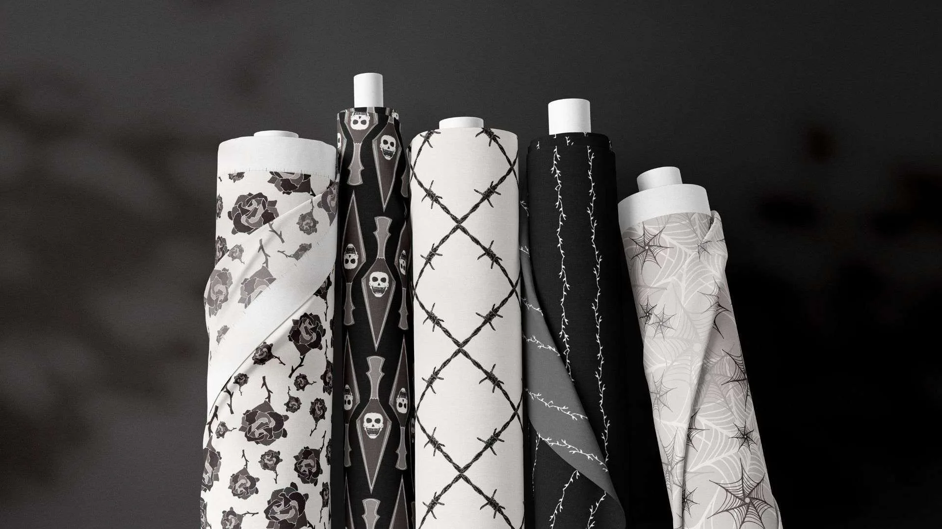 Home 1 A group of red and black patterned paper rolls on a black background.